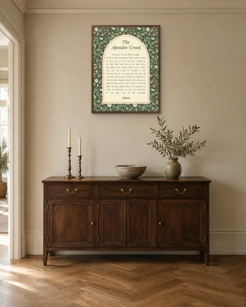 The Apostles' Creed art print framed above a wooden sideboard